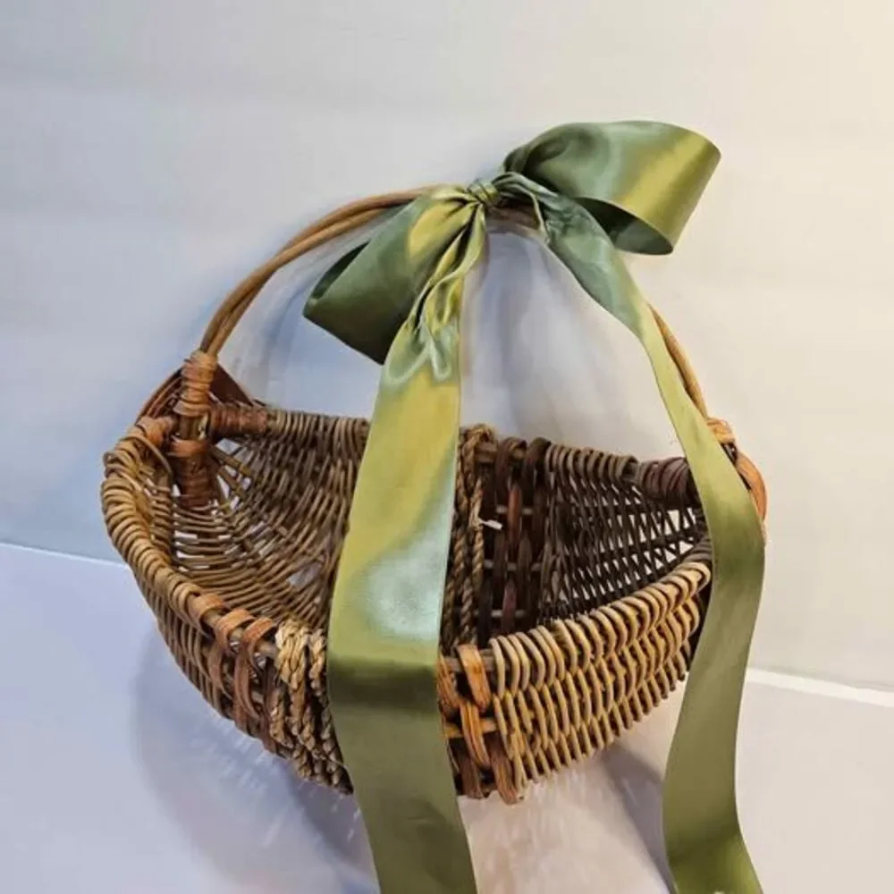 Wicker Basket with Green Ribbon, Broken Handle. Flat side. Wall decor